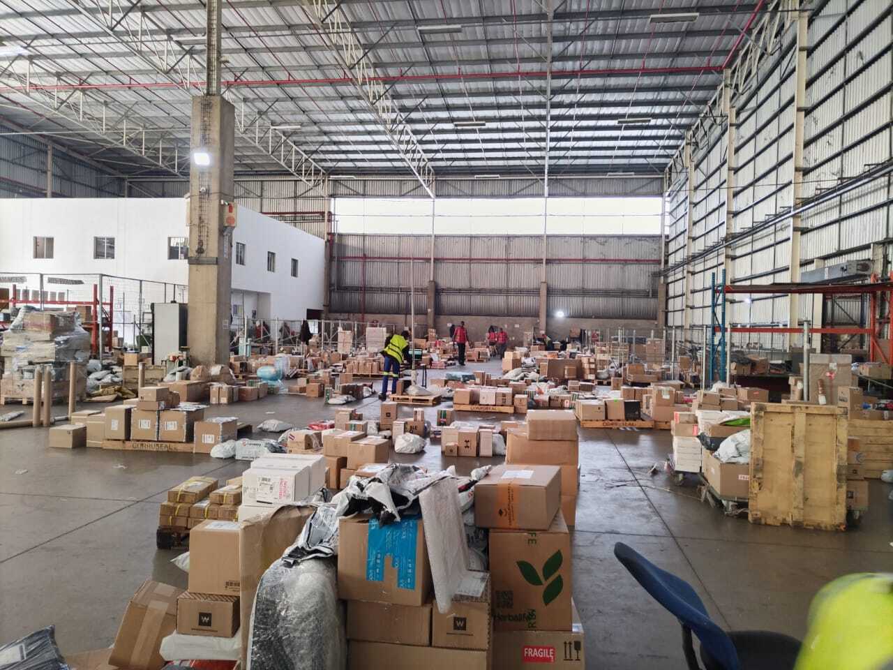 Inside our warehouse with staff handling packages